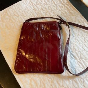 Burgundy Eel skin purse. 10x8.